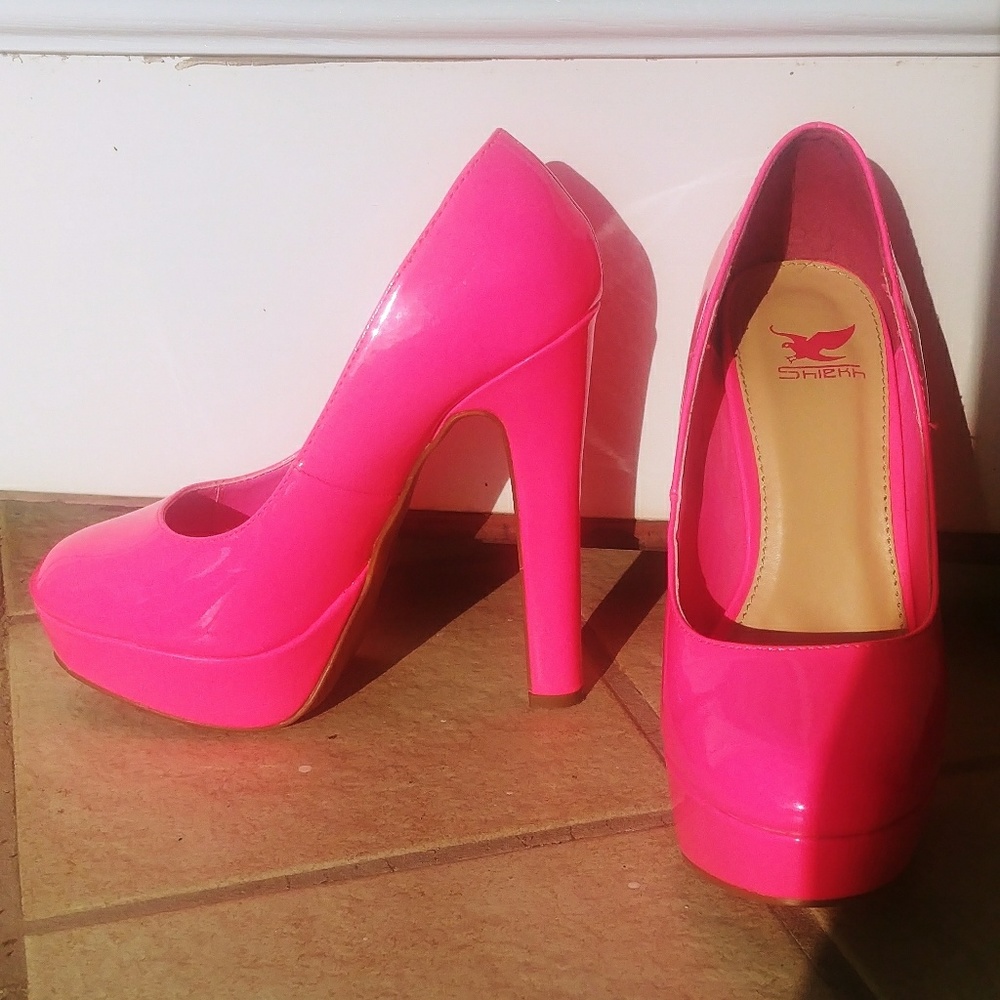 Neon pink platform heels